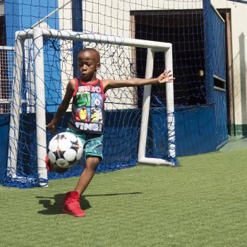 Child kicking a ball