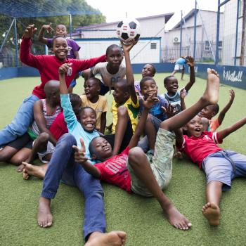 Children laying on the ground